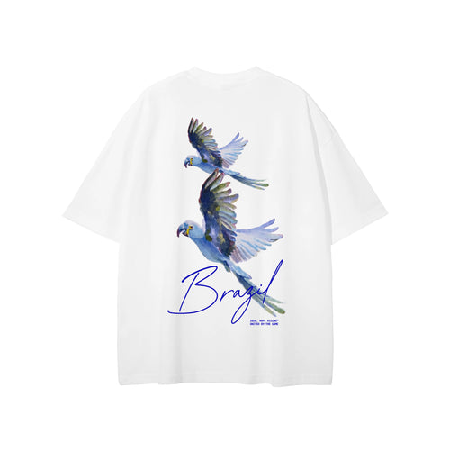 White t-shirt with blue parrot design and 'Brazil' text on a white background